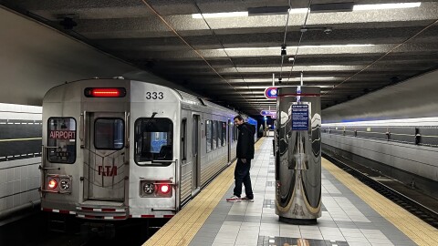 A passenger about to board a GCRTA Rapid Transit rail car at the Cleveland Hopkins International Airport.