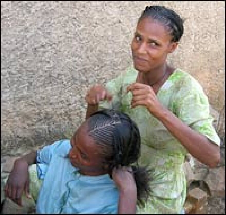 A woman braids her sister's hair in the disputed town of Badme, Ethiopia. An international border commission has ordered Ethiopia to return Badme to Eritrea but Ethiopia refuses to do so.