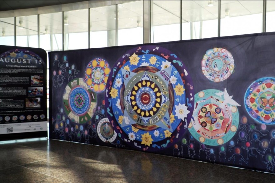 Titled “August 15,” the mural’s focal point is an abstract clock, which artist Tiffany Black said represents the waiting evacuees had to endure.
