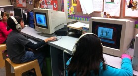 Elementary school children practice their English skills with an interactive program mean for English Language Learners.