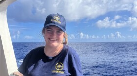 Jacqueline Ratliff stands aboard the Nautilus exploration vessel. It is capturing deep sea habitats in the Pacific.