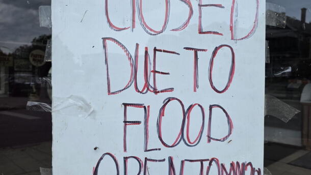A sign posted on the door of Gino's Italian Bakery on Sept. 4 following flooding on Hertel Avenue