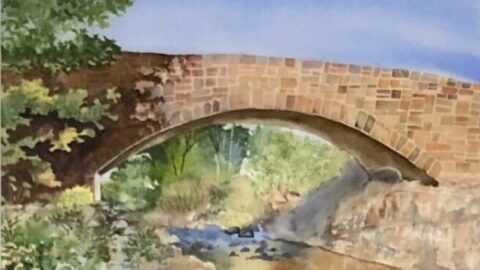 Watercolor painting of an old stone bridge over a river