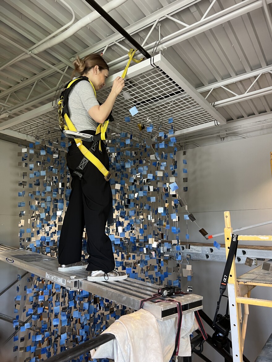 Mabel Poblet, an artist from Cuba, installs her 49-foot tall High Tide installation at The Studios of Key West in November 2022.