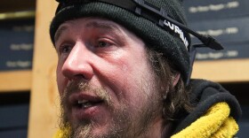 A man with a beard and a jacket