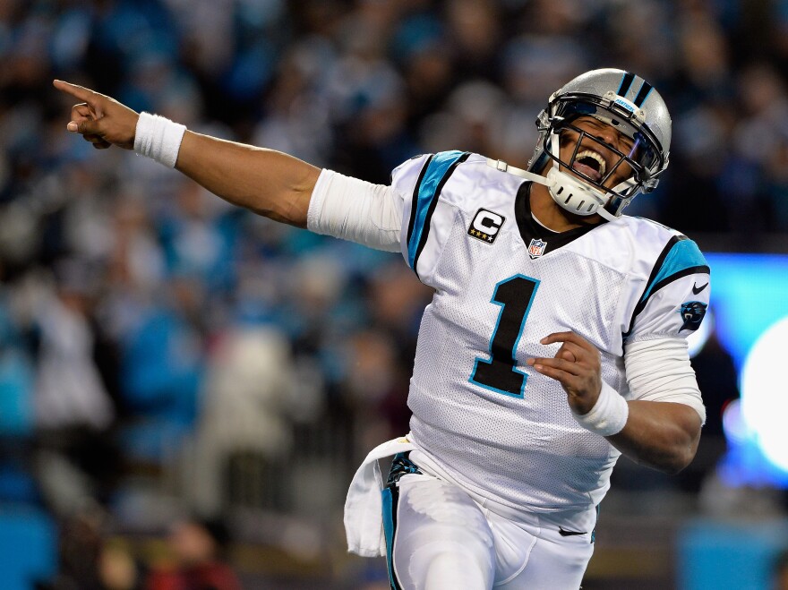 Cam Newton celebrates after a touchdown against the Arizona Cardinals, on Sunday in Charlotte, N.C.