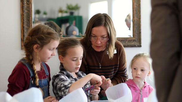 Ella Kerner, branch lead for Hunters and Colville libraries, helps young learners with their mini greenhouses. The rural library is one of seven at risk of facing service and hour cuts if an operations levy doesn’t pass this April.
