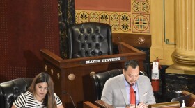 A chair for Columbus Mayor Andrew Ginther sits empty at a Columbus City Council meeting on July 21, 2025.