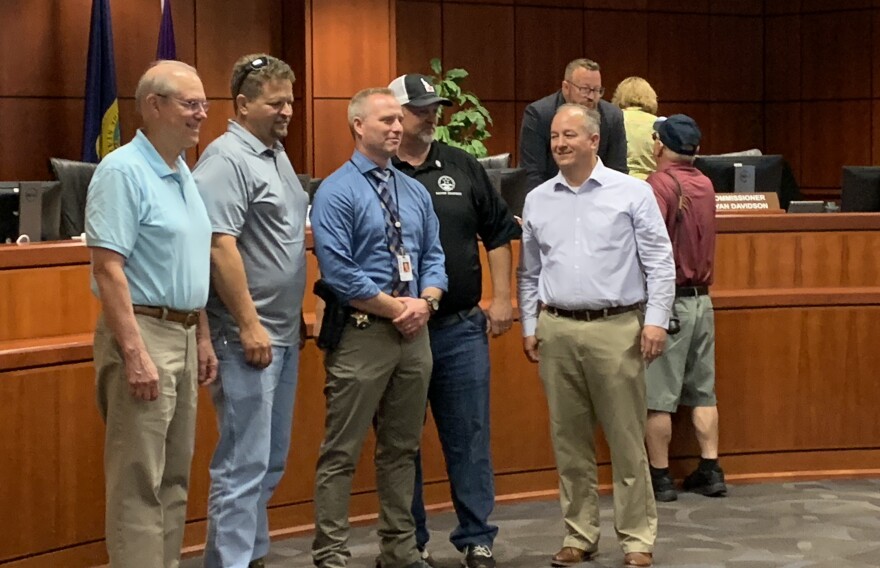 Lt. Matt Clifford (center, wearing a tie) poses with supporters after being named Ada County Sheriff.