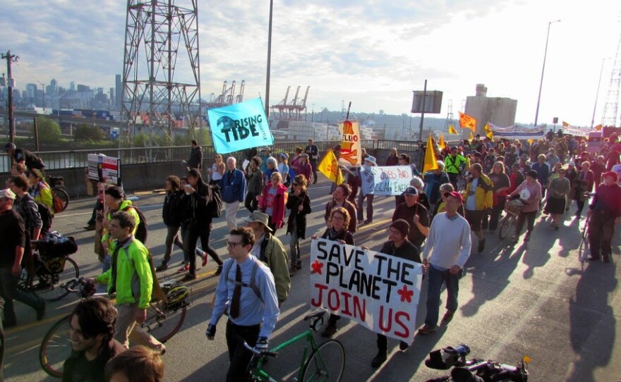 Protesters marched toward Terminal 5 at the Port of Seattle on Monday, aiming to keep workers from entering the terminal.