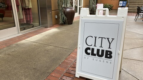 Sandwich board advertising City Club of Eugene