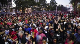 Crowds stand along the Las Vegas Strip during a rally to celebrate the Las Vegas Aces' WNBA basketball championship, Tuesday, Sept. 20, 2022, in Las Vegas.