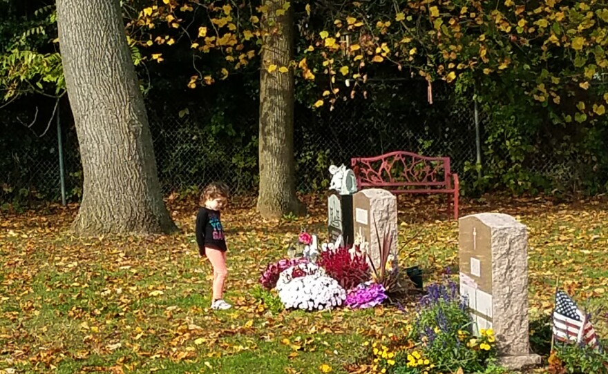 Hailey, now 5, at her mother's grave.