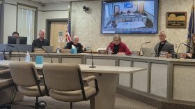 Lincoln County commissioners sit at a table