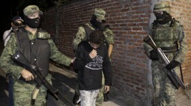 A 2010 file photo shows Edgar "El Ponchis" Jimenez Lugo in the city of Cuernavaca, Mexico. The teenage U.S. citizen who acknowledged being a drug-cartel killer has finished his three year juvenile-offender term for homicide, kidnapping and drug and weapons possession.