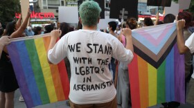 Members of the Turkish LGBTQ+ community hold rainbow flags during a solidarity protest action to support Afghan women in Ankara on Aug. 25, 2021. (Adem Altan/AFP via Getty Images)