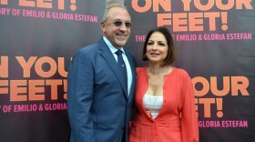In this Sept. 21, 2014 photo, Emilio Estefan, left, and Gloria Estefan pose for photos at the Adrienne Arsht Center for the Performing Arts in Miami during the casting for Broadway musical On Your Feet! (Ivan Cruz/AP)