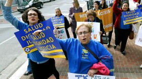 Women with the National Latina Institute for Reproductive Health demonstrate Wednesday outside the 5th U.S. Circuit Court of Appeals in New Orleans. A federal appeals court in New Orleans is considering whether a Texas law puts up an unconstitutional obstacle to women seeking abortions.