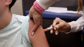 A child receives a standard immunization on Sept. 15, 2025, in Coral Gables, Florida. (Joe Raedle/Getty Images)