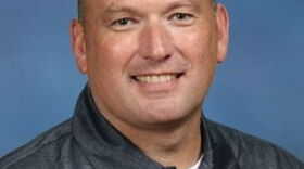 David Solz, former Gilchrist Principal, has been moved to the district office and faces an ethics reprimand after self-reporting a relationship with a married teacher at his school. 