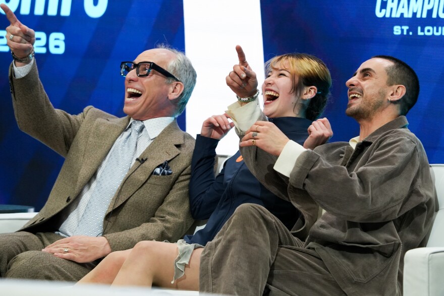 Alysa Liu, of St. Moritz ISC, reacts to a highlight of her women's short program alongside her coaches during the 2026 U.Sr Figure Skating Championships at the Enterprise Center on Wednesday, Jan. 7, 2026, in St. Louis’ Downtown West neighborhood.