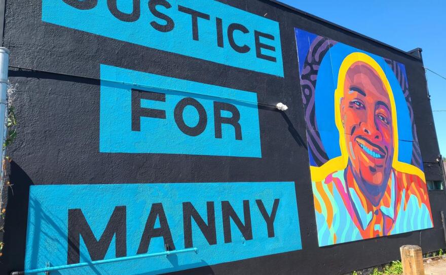 A mural in Tacoma's Hilltop neighborhood calls for justice for Manuel Ellis, who was killed while being restrained by Tacoma police on March 3.