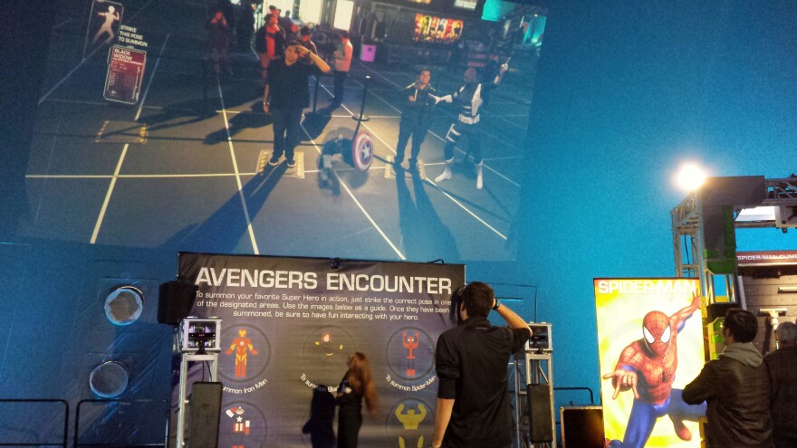 People summon super heroes during the Avengers Encounter at the Avengers Experience.