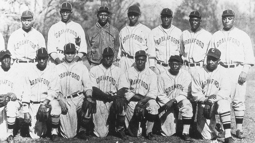 The Pittsburgh Crawfords team of 1932 included future Hall of Famers Satchel Paige (back row, second from left), Josh Gibson (to the right of Paige), and Oscar Charleston (far right). The team is seen here at a spring training site in Hot Springs, Ark.