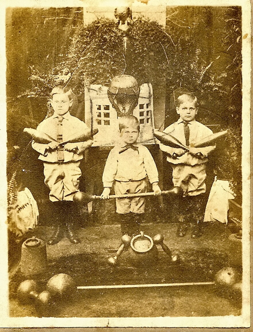  1918 photo of Louis Mayer's father (Louis E. Mayer), and uncles Gus (Gustave John Mayer) and Rudolph Mayer on the stage at the Turnverein von New Orleans. Uncle Gus is top left, Louis Mayer is in the middle.