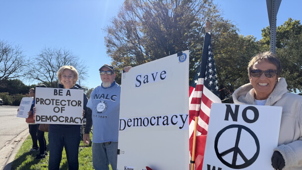 Lynn Solontoi and Eric Oberg of Monmouth and Vanessa Bell of Galesburg at the No Kings: Vote Early rally in Galesburg.