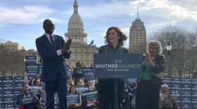 First-term Gov. Gretchen Whitmer, center, is applauded by Lt. Gov. Garlin Gilchrist II, left, and campaign volunteer Susan Anderson, as Whitmer speaks to supporters before she and Gilchrist II turn in 30,000 nominating signatures to run for reelection on Thursday, March 17, 2022, in Lansing. Mich.