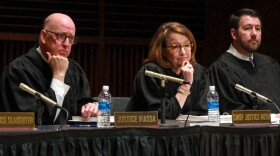 From left, Indiana Supreme Court Justice Mark Massa, Chief Justice Loretta Rush and Justice Derek Molter listen to student questions at a traveling oral argument at the University of Indianapolis on Apr. 11, 2023.