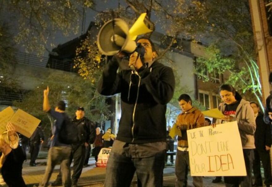 People protested Monday outside the AISD's headquarters. They spoke out against a proposal for in-district charter programs at some East Austin schools.