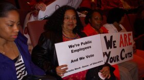 Teachers, parents and students protested proposed teacher cuts at board meeting.