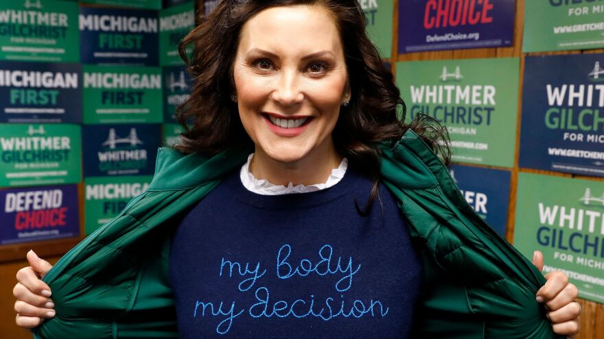 Michigan State Governor Gretchen Whitmer shows a "My Body My Decision" shirt at the 14th District Democratic Headquarters in Detroit, Michigan, on November 8, 2022.