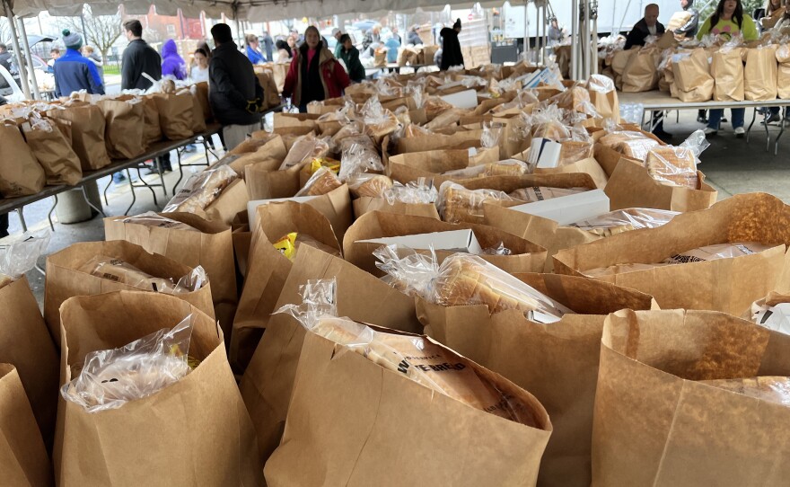 Bags full of traditional Thanksgiving items are ready for families to pick up outside the Scranton Cultural Center.