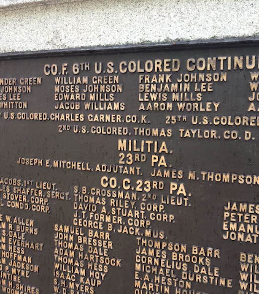 A brass plaque near the Centre County Courthouse lists the names of the U.S. Colored Infantry and Militia who served in the Civil War. 