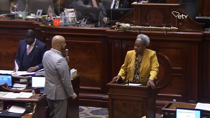 Rep. John King, D-Rock Hill, speaks with Rep. Wendy Brawley, D-Hopkins, during the debate over the trans student athlete ban bill that the House passed largely along party lines this week.