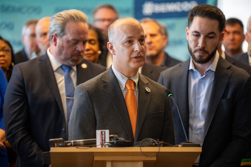 Lansing Mayor Andy Schor at a press conference where Michigan local officials declared their opposition to proposed state preemptive zoning laws.
