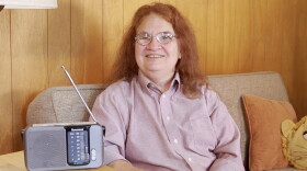 WKAR Radio Reading Service listener Roberta McCall, with a WKAR RSS radio receiver.