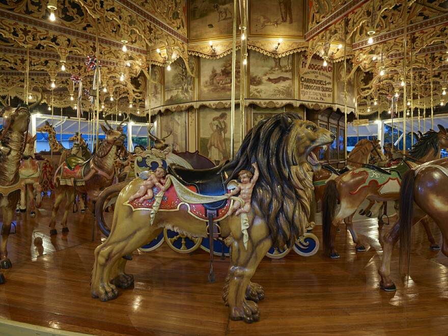 One of the most elaborate of approximately 150 (out of originally 2,500 or so) carved wooden carousels in America -- the Kit Carson County Carousel in the eastern Colorado town of Burlington, on the Kansas border. The sixth of 74 carousels manufactured by the Philadelphia Toboggan Company between 1904 and 1933, this is a three-row, stationary (the animals do not move up and down) "merry-go-round" housed in a 12-sided frame building. It is the only antique carousel in America still having original paint on both the scenery panels and on the menagerie -- not just horses but all sorts of animals.