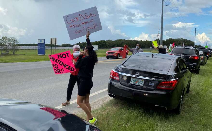 Protesters lined the highway in front of the Coleman federal prison complex in Sumter County on Saturday afternoon. Photo: Joe Byrnes