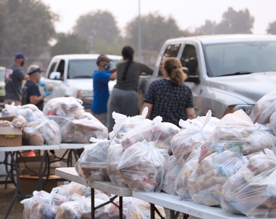 Wildfire evacuees pick up food in 2020.