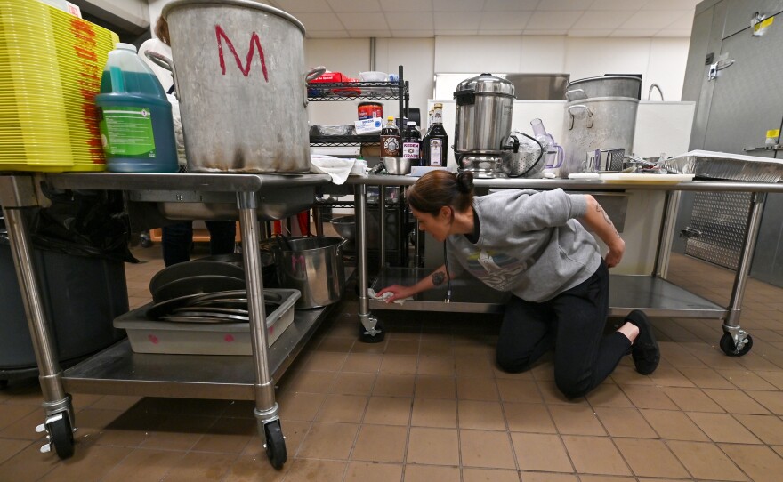 Bank+Vine Executive Chef Barbara Hill wipes all metal surfaces in the Friedman JCC's kitchen for Passover.