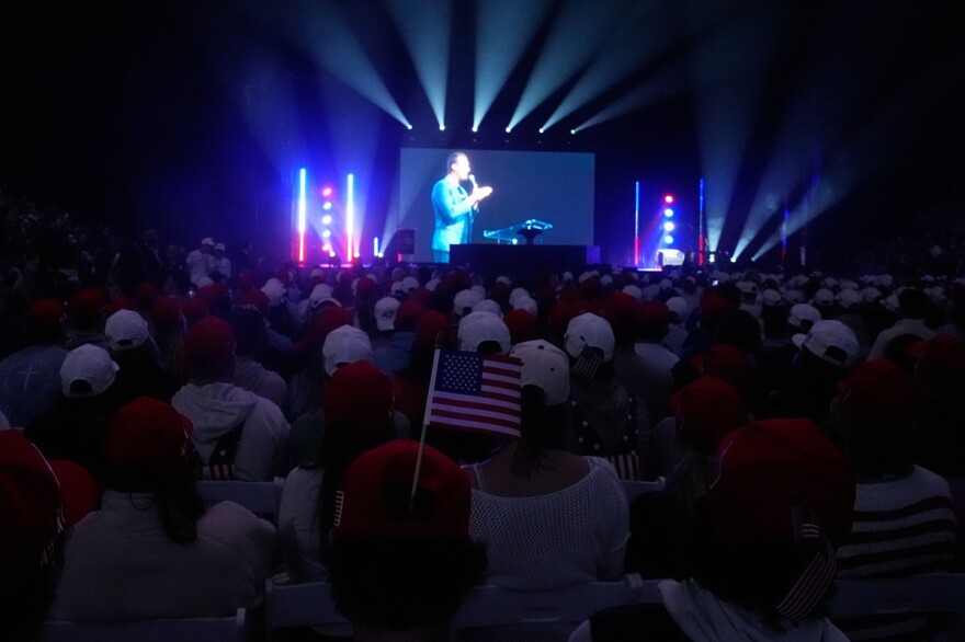 Attendees watch a video of Charlie Kirk at a "This Is the Turning Point" campus tour event at the University of Mississippi, in Oxford, Miss., Wednesday, Oct. 29, 2025.
