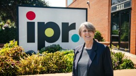 Retired CEO Myrna Johnson stands outside IPR's Des Moines studio.