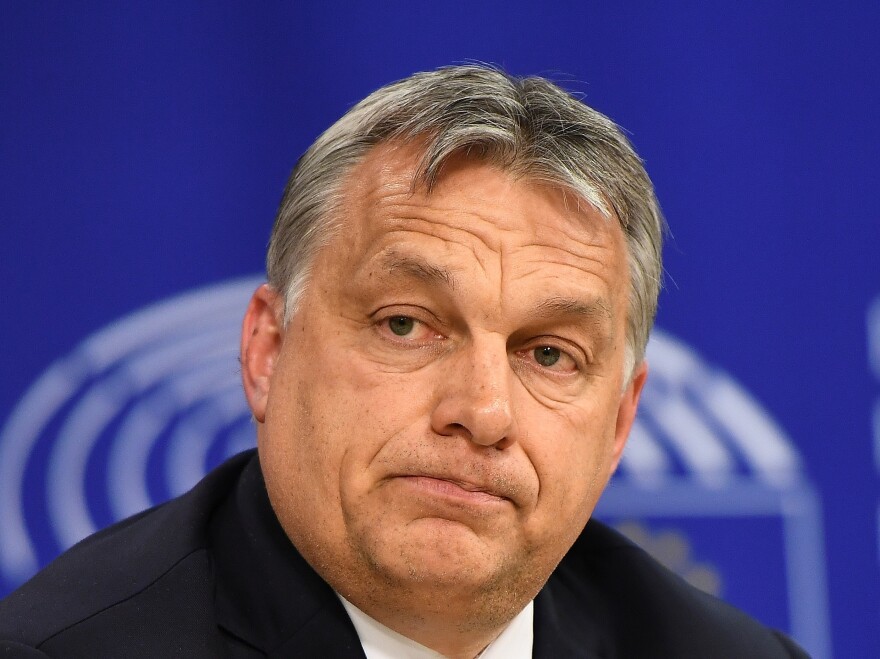 Hungary's Prime Minister Viktor Orbán addresses a press conference after attending a plenary session at the European Parliament in Brussels last April, after the EU launched legal action against Hungary.