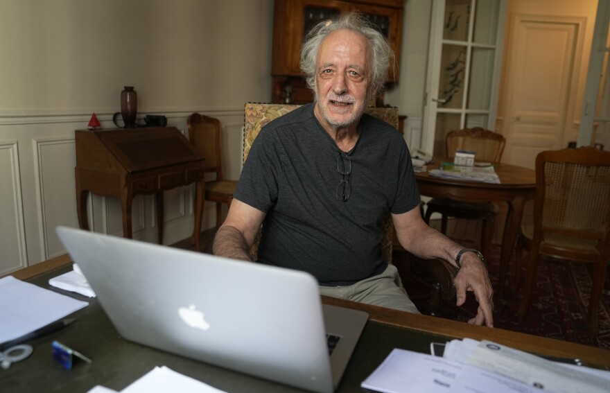 French scientist Pierre Agostini poses in his apartment, Tuesday, Oct.3 , 2023 in Paris. The Nobel Physics award went to French-Swedish physicist Anne L'Huillier, French scientist Pierre Agostini and Hungarian-born Ferenc Krausz for their work with the tiny part of each atom that races around the center and that is fundamental to virtually everything: chemistry, physics, our bodies and our gadgets.
