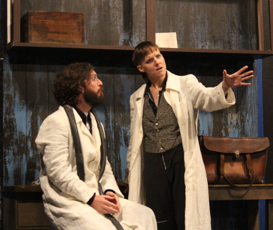 Gray (Amber McNew) tells his assistant Cornelius (Ben Williamson) that the key to inventing is find a problem, solve and find a way to monetize it.