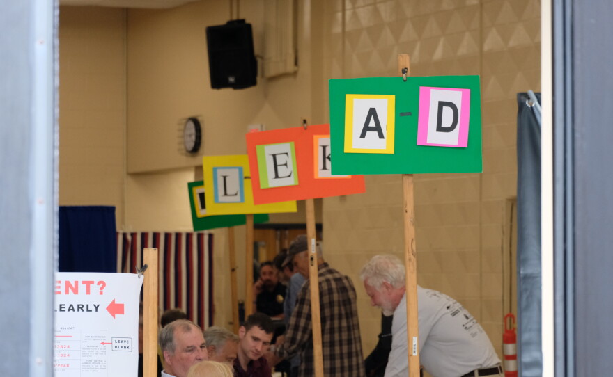 Voters and election workers in action at Oyster River High School in Durham, Sept. 8, 2026.